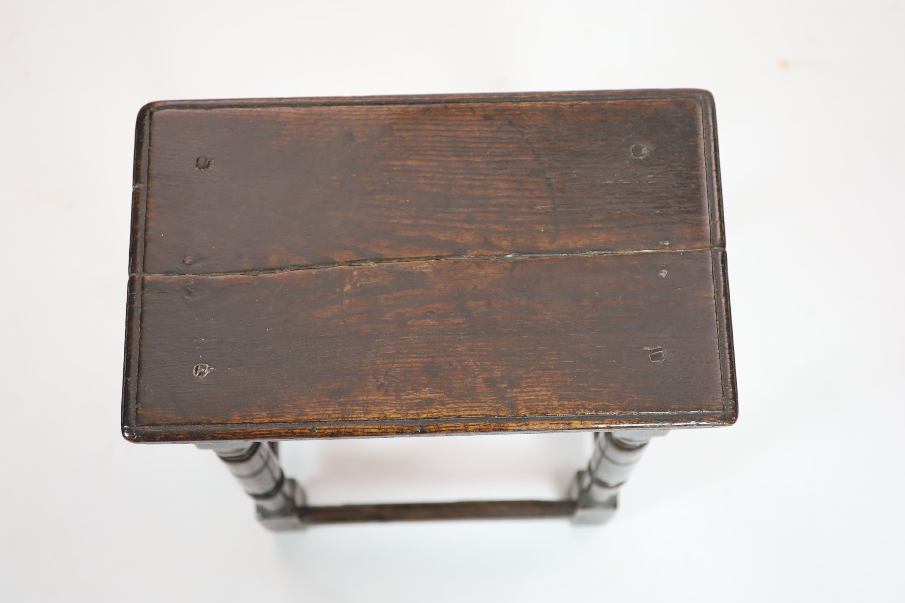 A mid-17th century oak joint stool H 58cm. W 47cm. D 28cm.